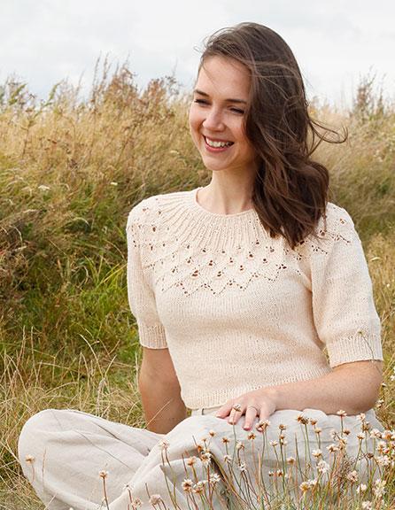 Swing by Spring Top / DROPS 222-32 - Knitted sweater in DROPS Belle. Piece is knitted top down with round yoke, lace pattern, leaf pattern and short balloon sleeves. Size: S - XXXL