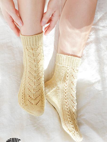 Bright Morning Socks / DROPS 247-20 - Knitted socks in DROPS Nord. Piece is knitted with lace pattern. Size 35-43.