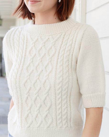 April Snow / DROPS 259-1 - Knitted jumper in DROPS Daisy or DROPS Merino Extra Fine. Piece is knitted bottom up with cables, short sleeves and double neck edge. Size: S - XXXL.