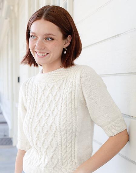 April Snow / DROPS 259-1 - Knitted jumper in DROPS Daisy or DROPS Merino Extra Fine. Piece is knitted bottom up with cables, short sleeves and double neck edge. Size: S - XXXL.