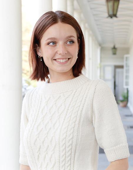 April Snow / DROPS 259-1 - Knitted jumper in DROPS Daisy or DROPS Merino Extra Fine. Piece is knitted bottom up with cables, short sleeves and double neck edge. Size: S - XXXL.