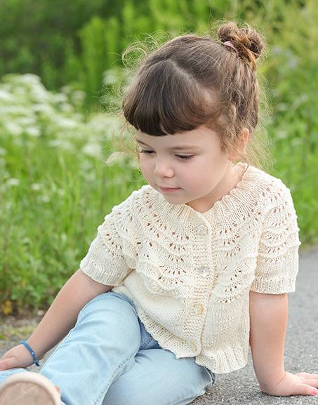 Marshmallow Morning Cardigan / DROPS Children 49-2 - Knitted, short jacket for children in DROPS Safran or DROPS BabyMerino. Piece is knitted top down with round yoke, I-cord, wave pattern and short sleeves. Size 2 - 12 years